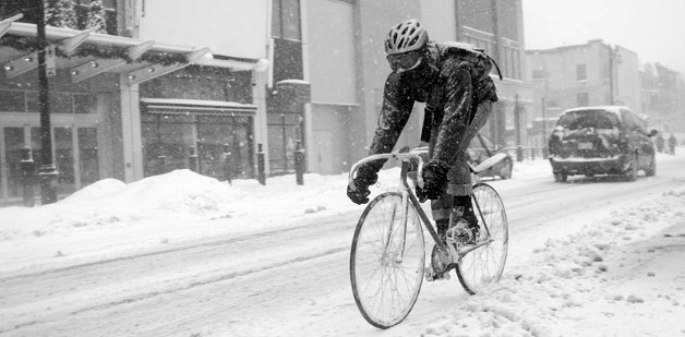 Cyclist riding in snow