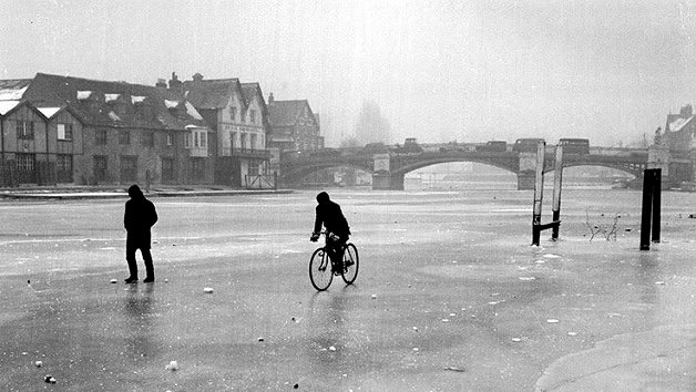Cyclist on the frozen River Thames, preferable to the roads